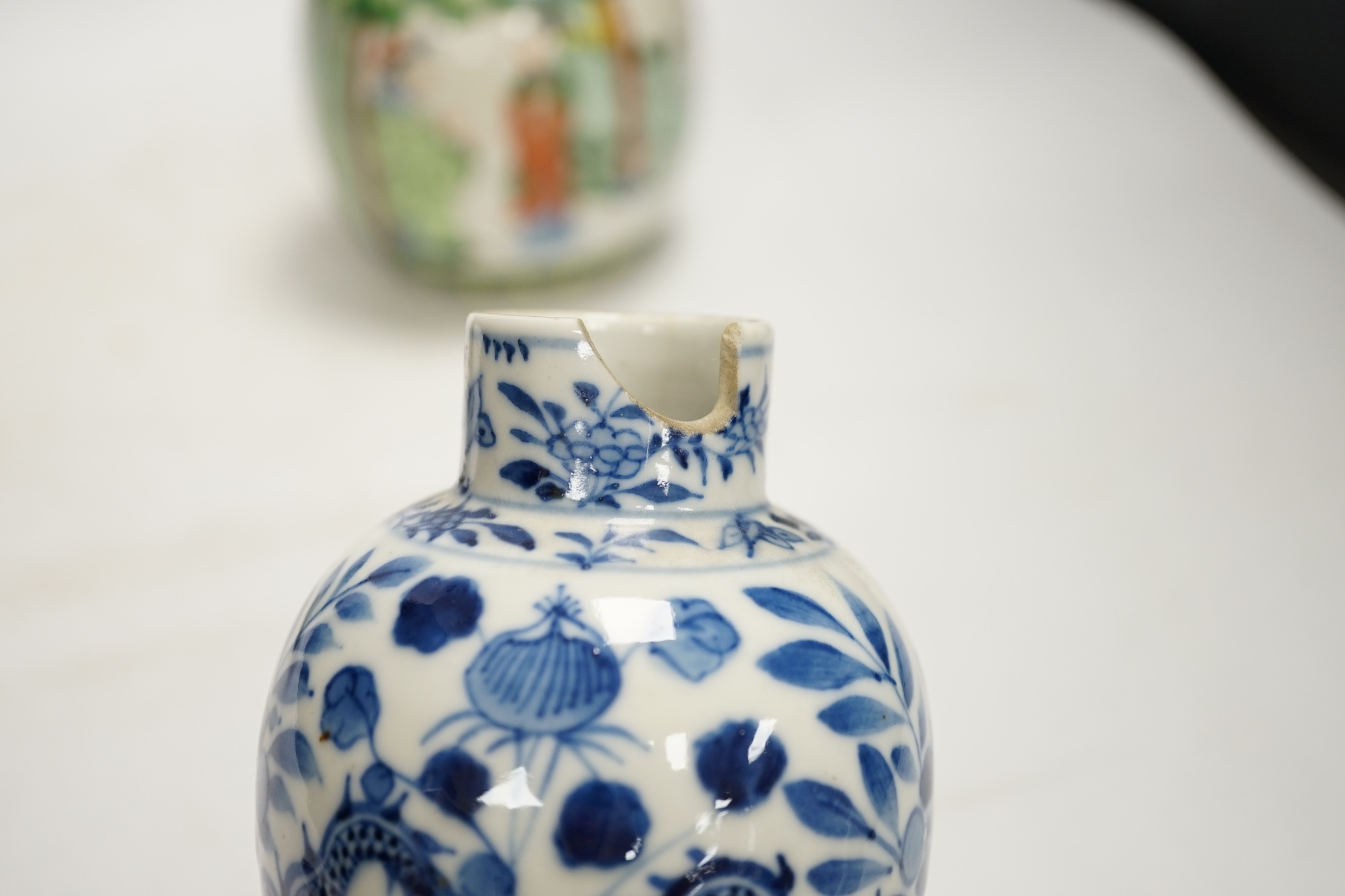 Chinese ceramics to include a crackleware vase and a blue and white vase, a jar and cover and a rice bowl, tallest 20cm high. Condition - all items damaged, overall poor
